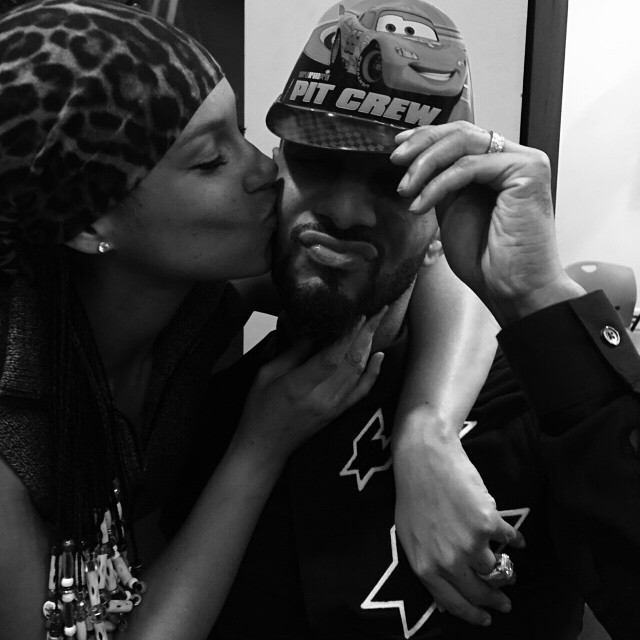 Swizz Beatz gets a big kiss from his wife Alicia Keys.