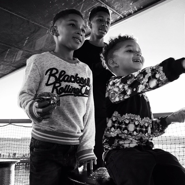 Egypt and his brothers kick it at his party.