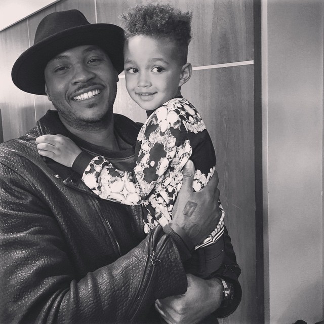 Knicks superstar Carmelo Anthony holds the birthday boy.
