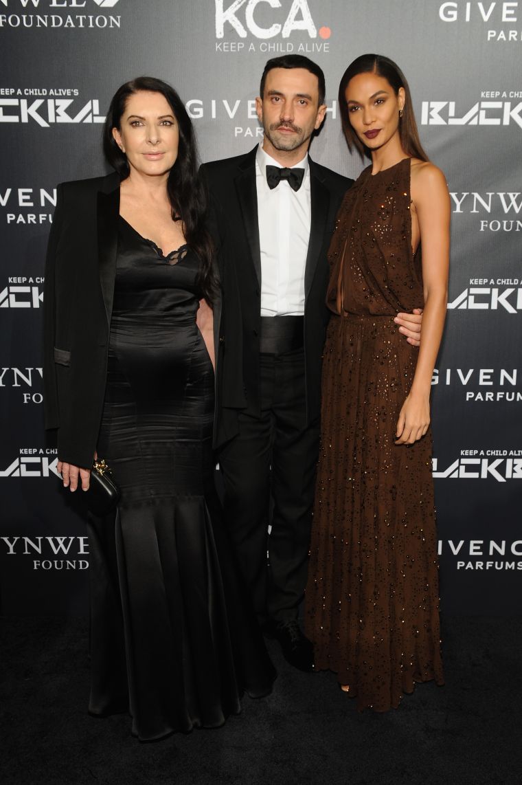Riccardo Tisci poses with two pretty ladies: Marina Abramovic and Joan Smalls.