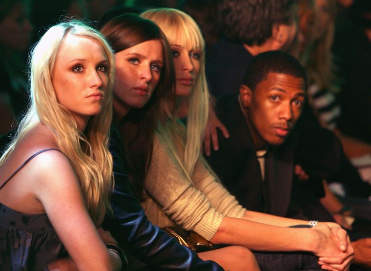 Nick attended a fashion show with Paris and Nicky Hilton.