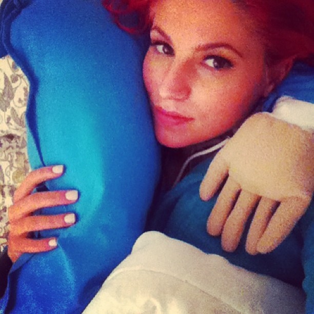 Carly cuddles with her one-armed boo.