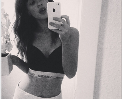 British songstress Foxes puts her own funky twist on the #MyCalvins selfie. Featuring perfect abs…and a flower pot.