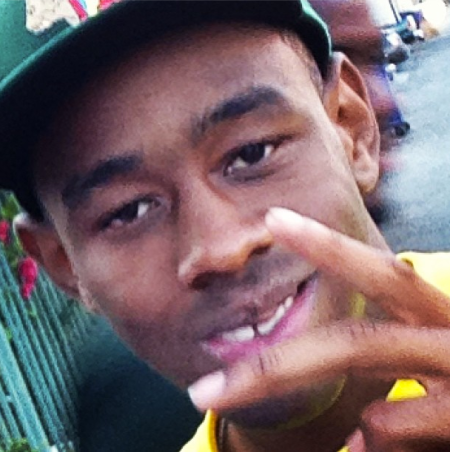 This is Tyler, The Creator chucking up very limp fingers.