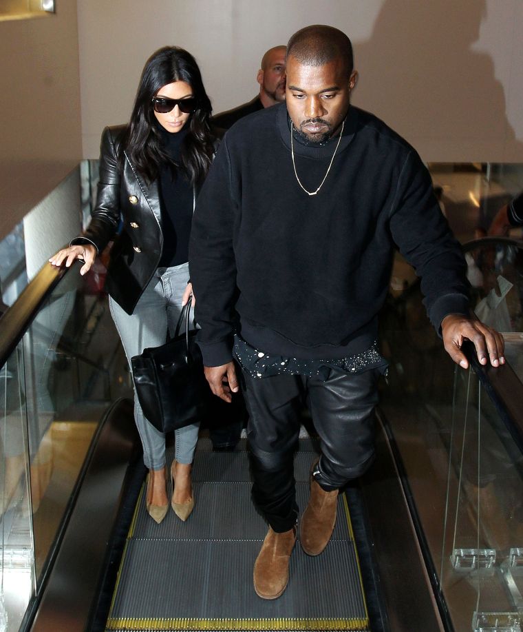 This is what Kanye and Kim look like when they arrive at LAX.