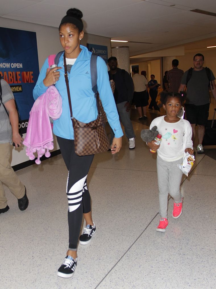Candace Parker and her daughter Lailaa keep it casual at LAX.