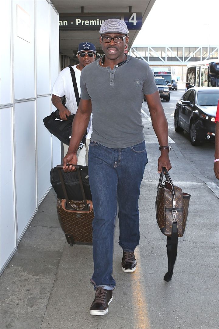 Former NFL star Michael Irvin strolls through LAX to catch a flight.