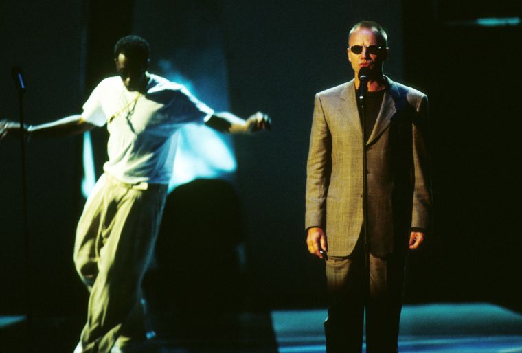 In honor of his deceased friend, Diddy, accompanied by Faith Evans and Sting, danced his heart out at the 1997 MTV Awards.