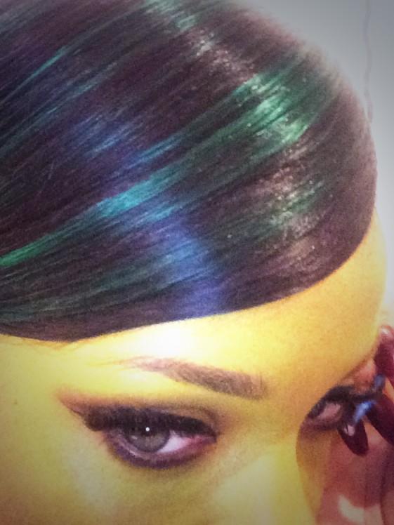 Rihanna dyes her hair green for the holiday.