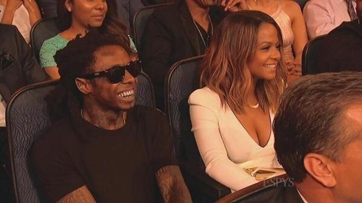 The couple laughing at fellow YMCMB rapper Drake at the 2014 ESPY Awards.