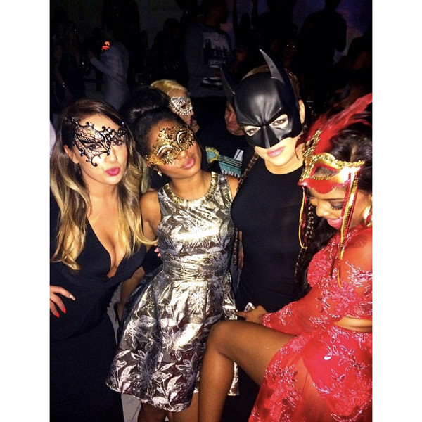 Khloe Kardashian poses it up with her “masked baes.”