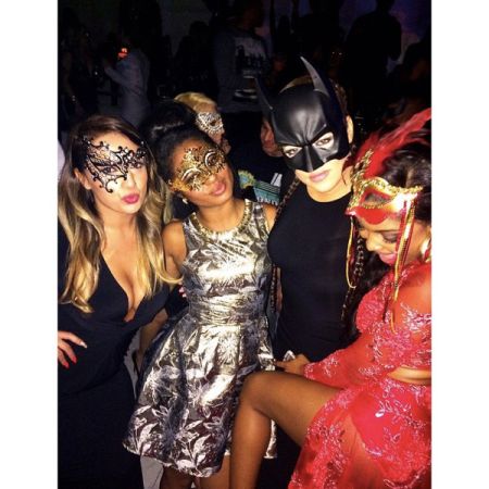 Khloe Kardashian poses it up with her “masked baes.”