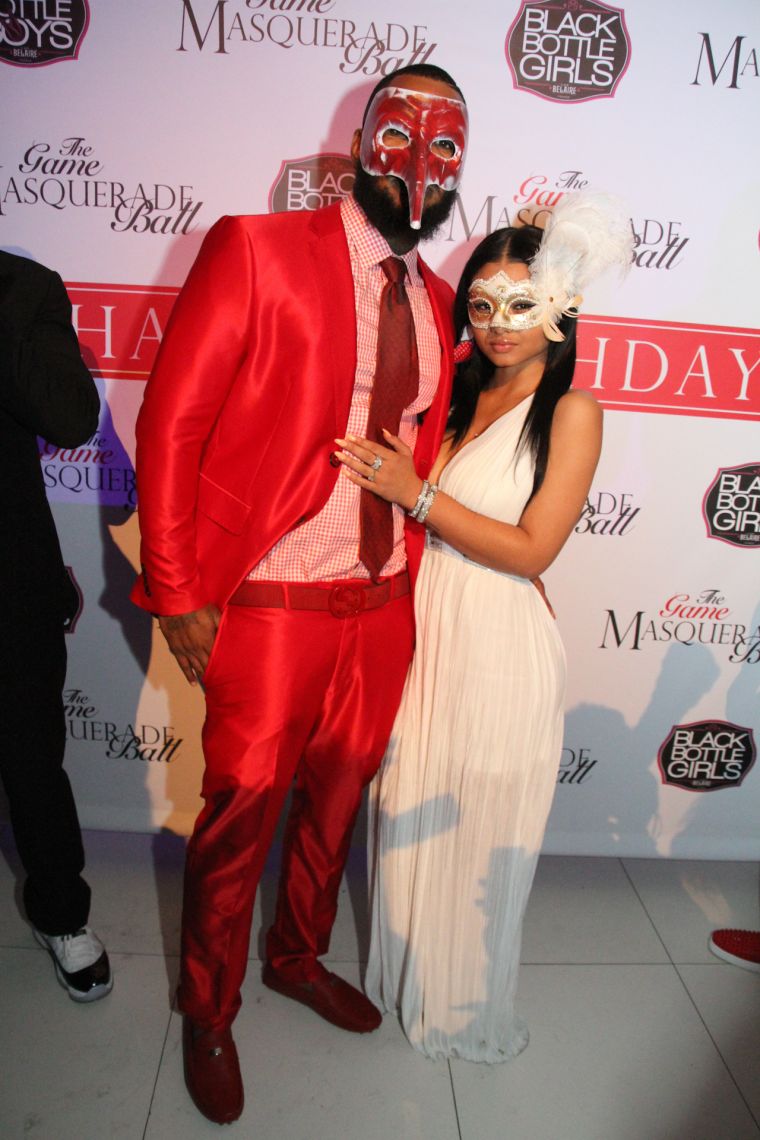 The Game and his rumored boo India Love pose on the carpet.