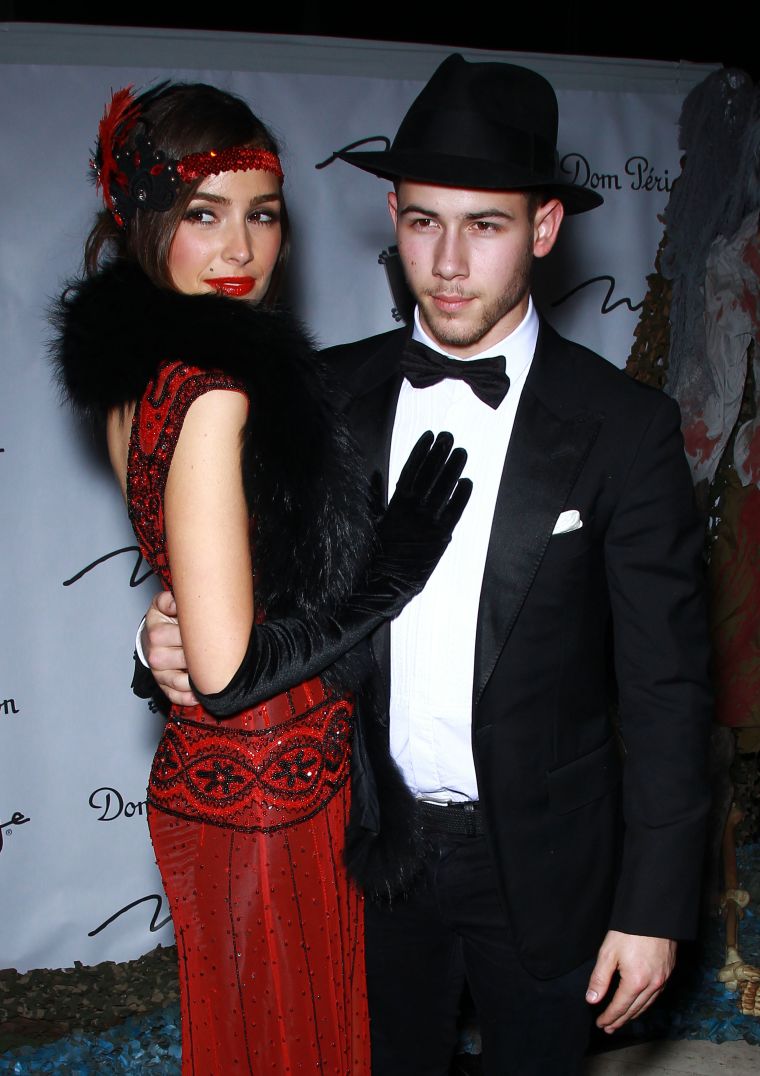 Nick Jonas and Olivia Culpo coordinate costumes as a couple.