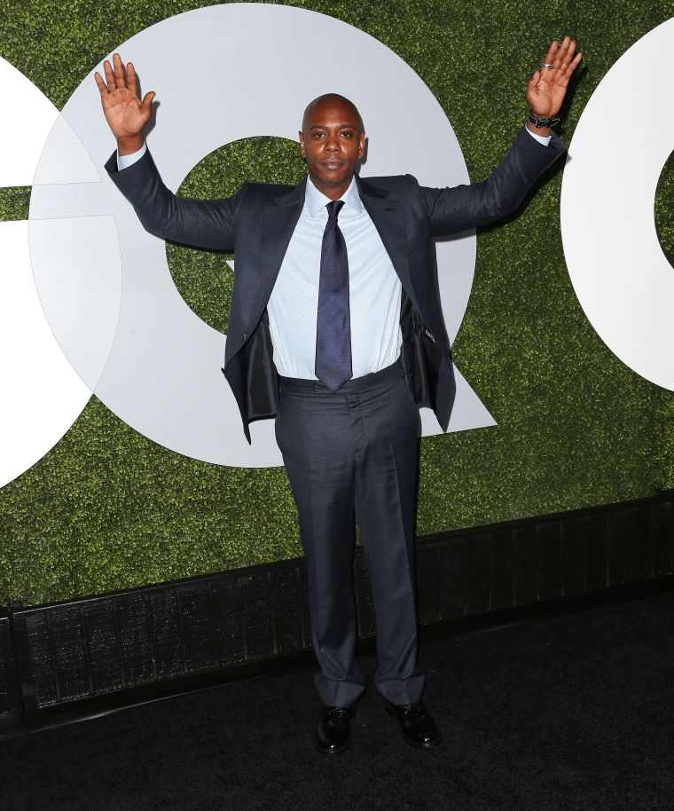 Dave Chappelle posed with his hands up for Mike Brown on the red carpet.