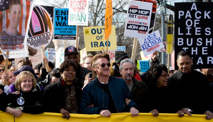 Actor Sean Penn and Reverend Jesse Jackson marched with activists during an anti-war rally.