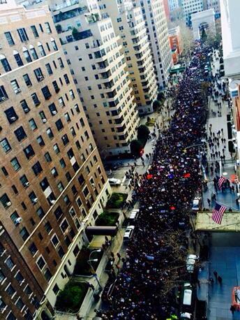 Thousands march together on their way to the NYPD headquarters.