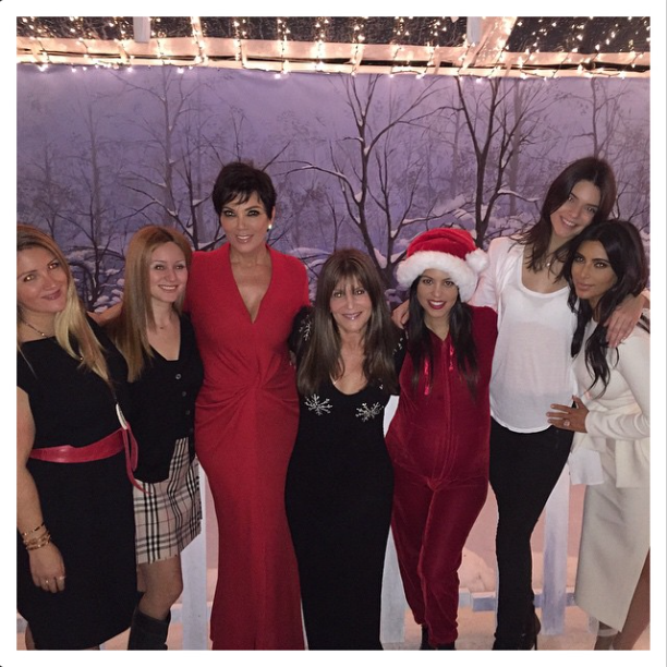 The Kardashian-Jenner crew gathers around for a picture.