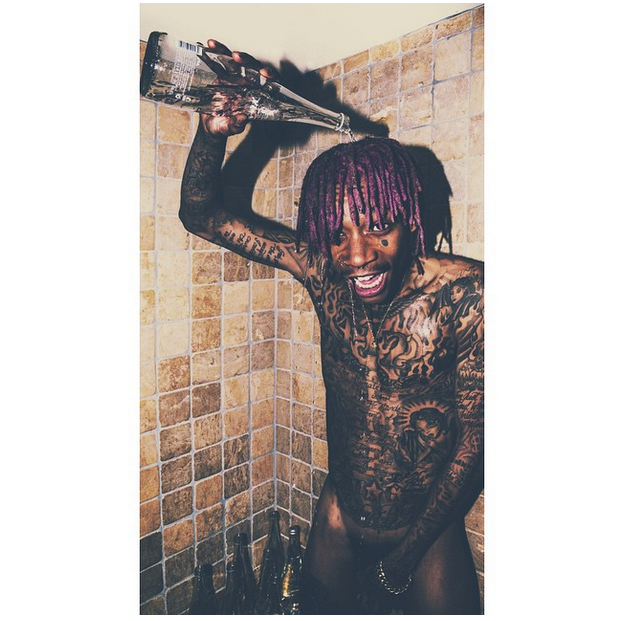 Wiz Khalifa poured water all over his naked body.