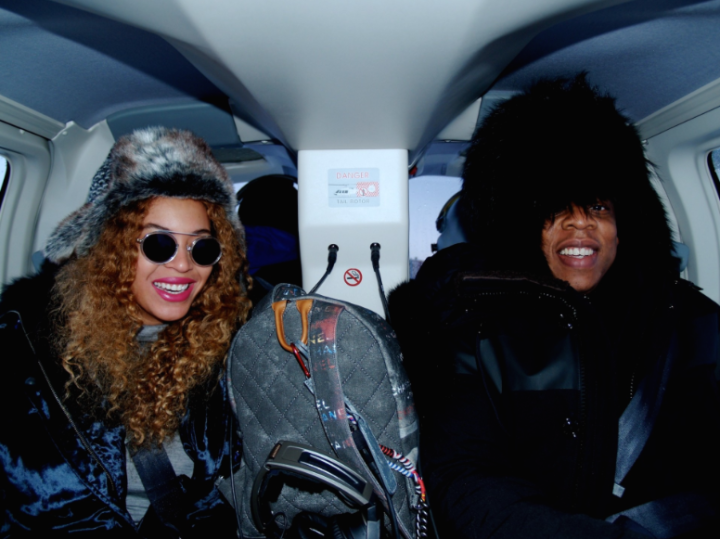 Beyonce & Jay Z show off their fly winter fashion while flying around Iceland in a helicopter.