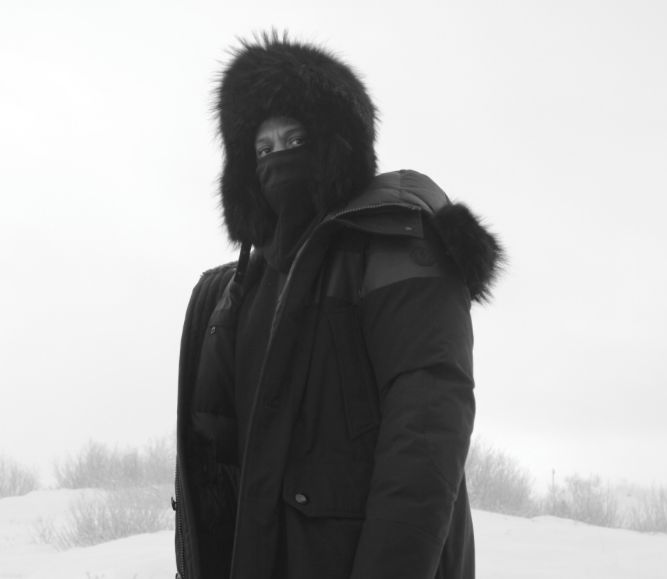 Jay suits up to keep warm while playing in the snow with his family.