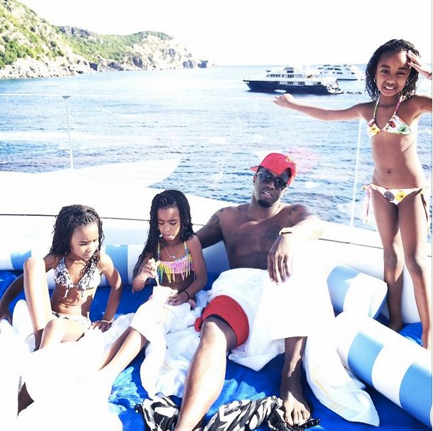 Diddy plays with his daughters in St. Barts.
