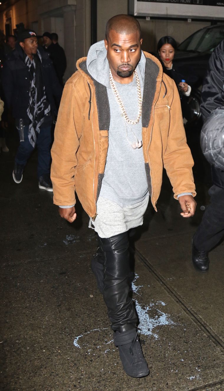 Kanye West kept it swaggy as he showed up to his Times Square performance for World AIDS Day.