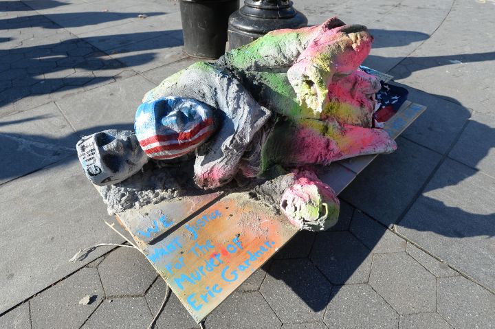 An artist participates in the protest through creative expression.