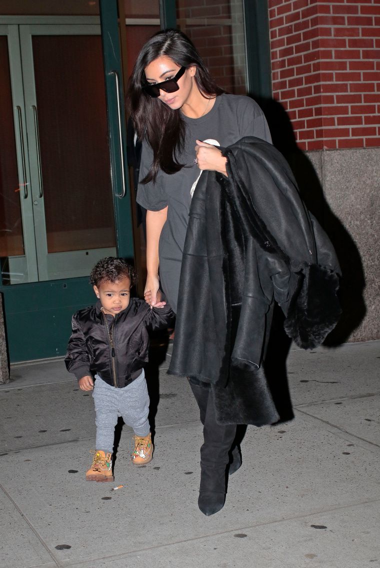 Kim kickin’ it with her mini-me North.