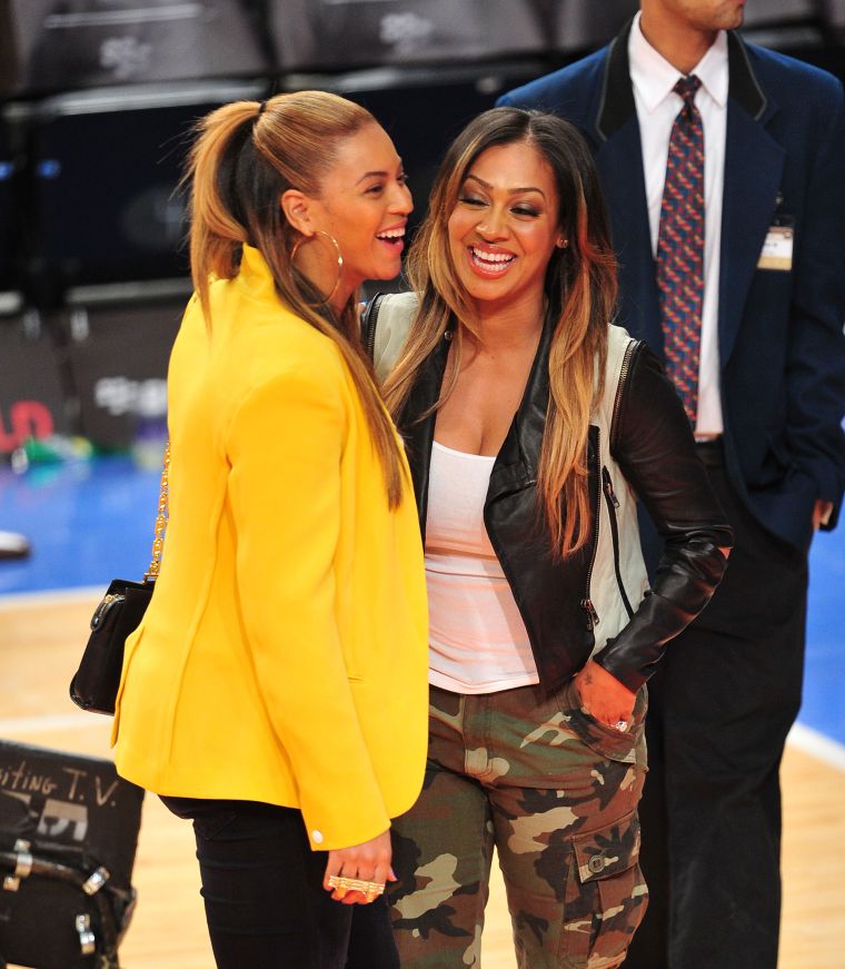 Bey and La La Anthony share a few laughs on the court.