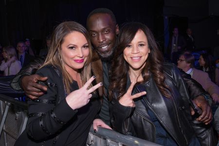 Angie Martinez and Michael K. Williams throw up the deuces.