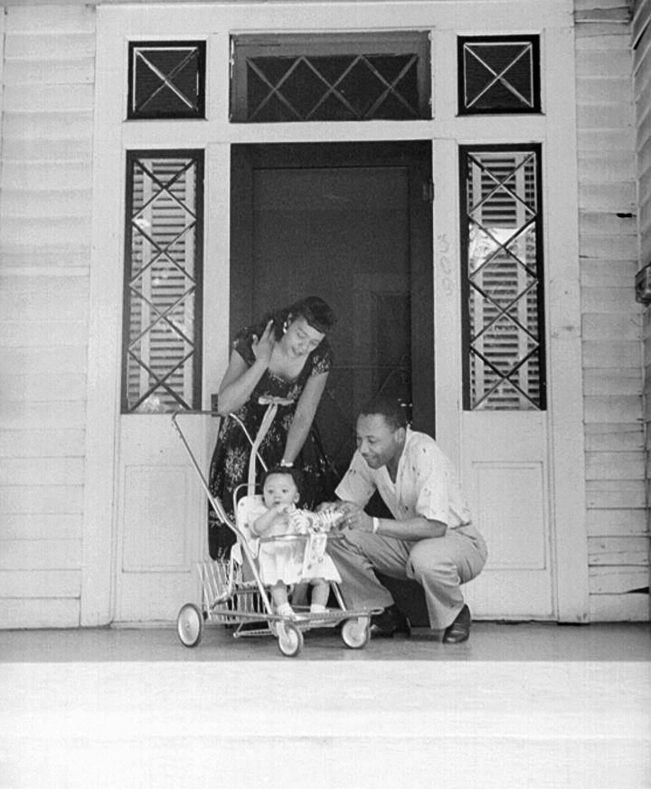 The family share a candid photo outside of their home in Montgomery, Alabama.