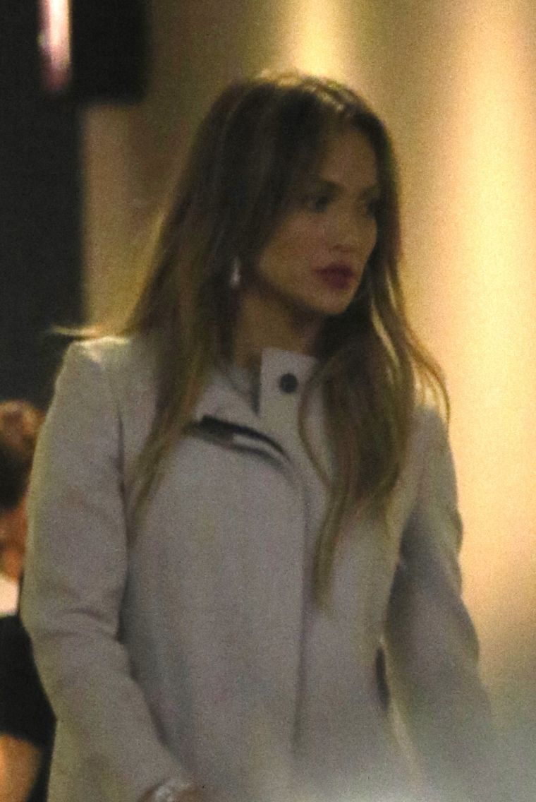 Jennifer Lopez leaves the W Hotel in true “Jenny from the block fashion,” in a red lip and hoop earrings.