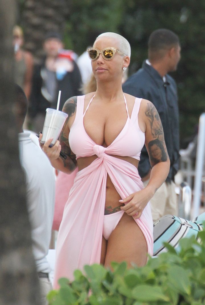 Amber Rose dons baby pink to show off her bikini body.