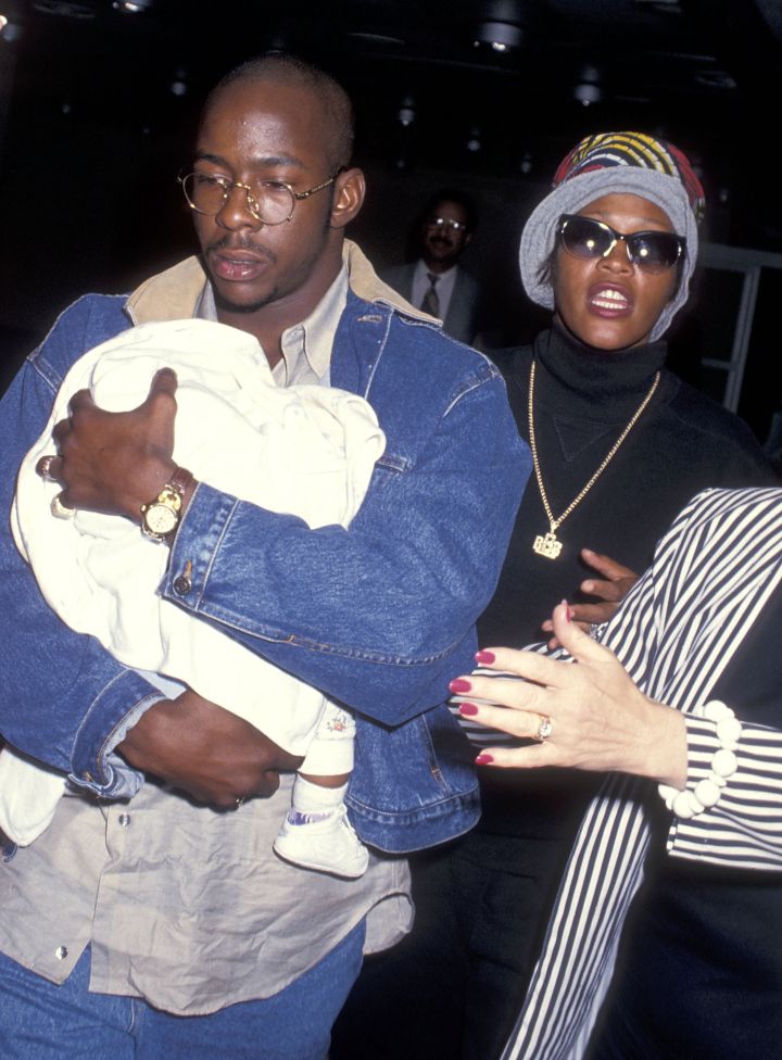 Bobby Brown, singer Whitney Houston, and daughter Bobbi Kristina Brown arrive to Los Angeles on June 9, 1993.