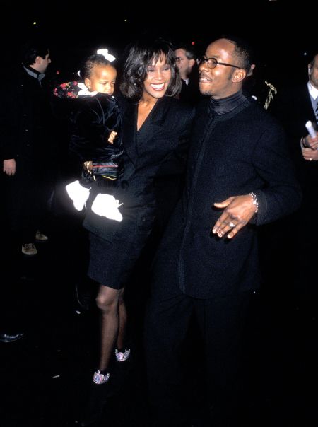 Whitney Houston, singer Bobby Brown, and daughter Bobbi Kristina Brown attend Bobby Brown’s 25th Birthday Party on February 4, 1994 at Tavern on the Green.