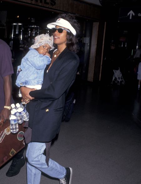 Mommy’s girl! Whitney Houston and daughter Bobbi Kristina Brown depart for New York City on July 1, 1995 at Los Angeles International Airport.