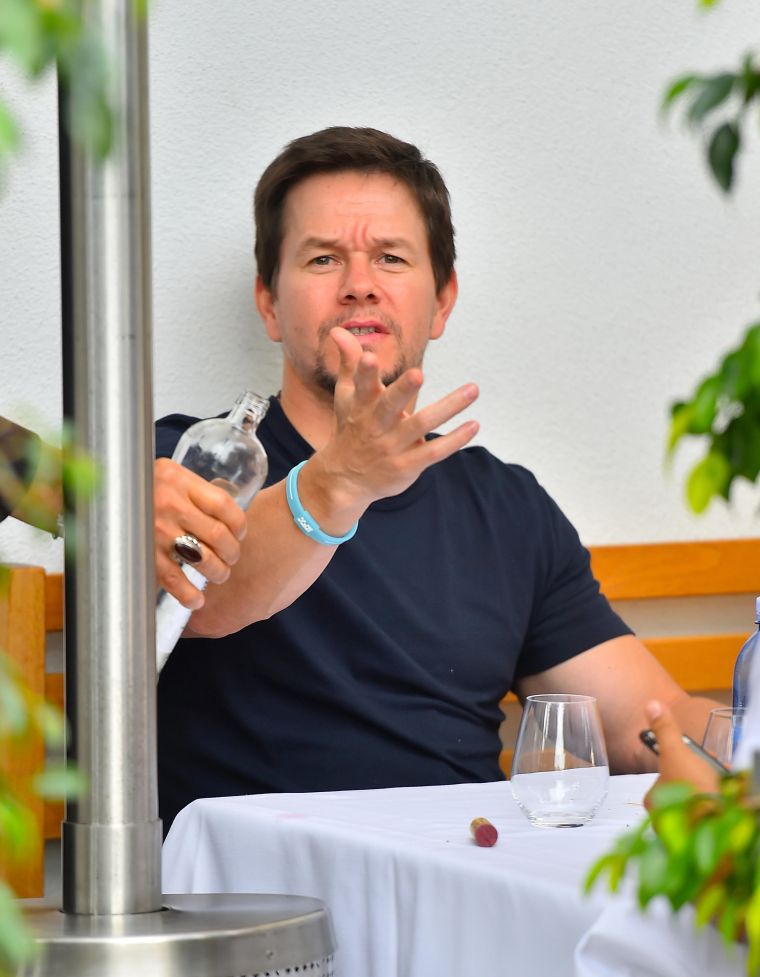 Mark Wahlberg was trying to enjoy a glass of wine with friends in Beverly Hills, but the paparazzi were being annoying.