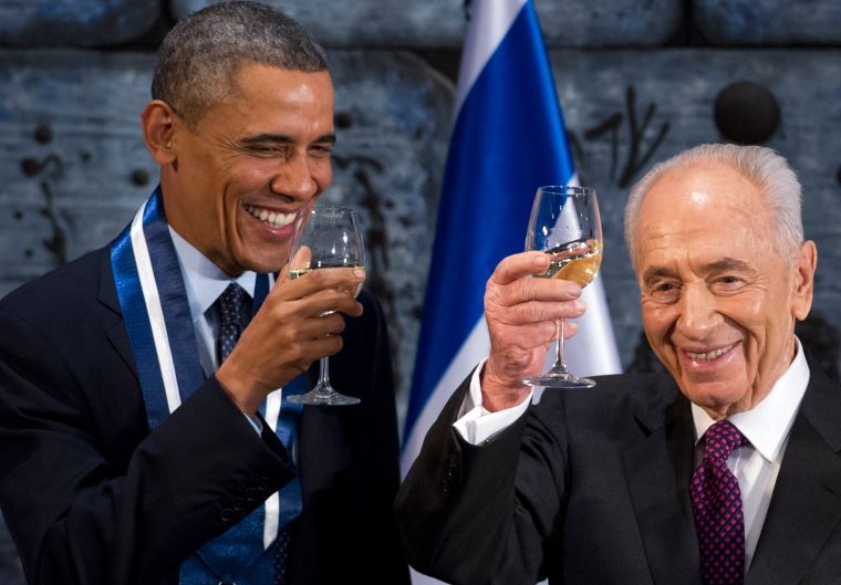 President Obama enjoys some white wine.