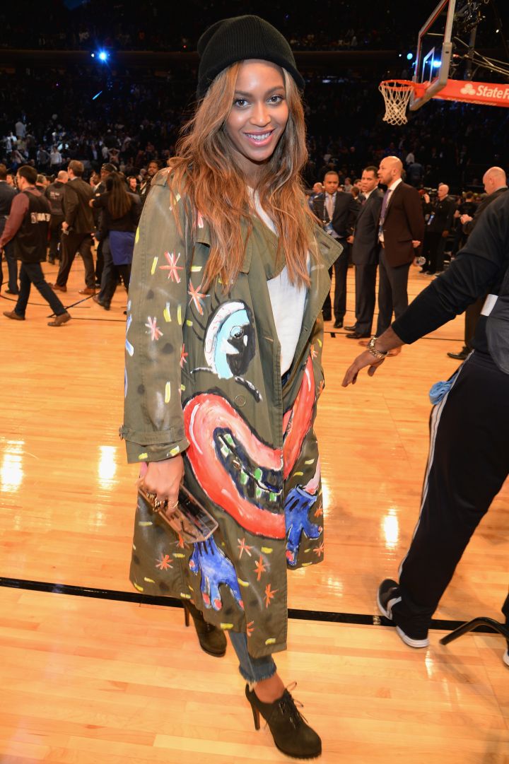 Beyonce poses on the sidelines.