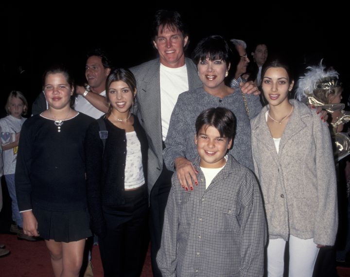 Bruce Jenner poses with his Kardashian krew.
