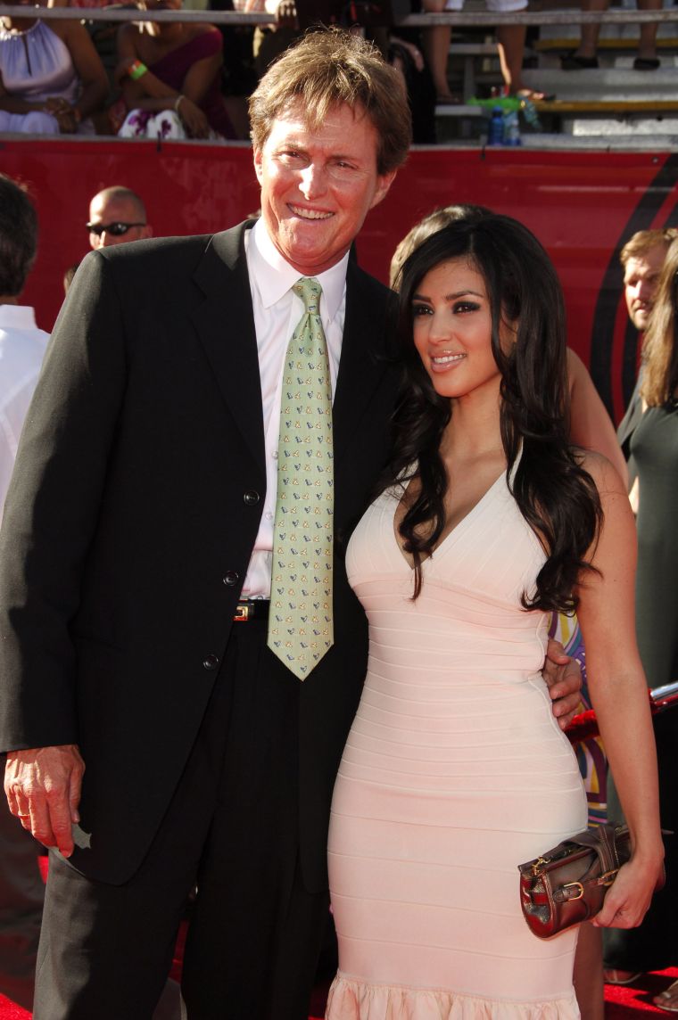 Bruce Jenner accompanies Kim on the red carpet.