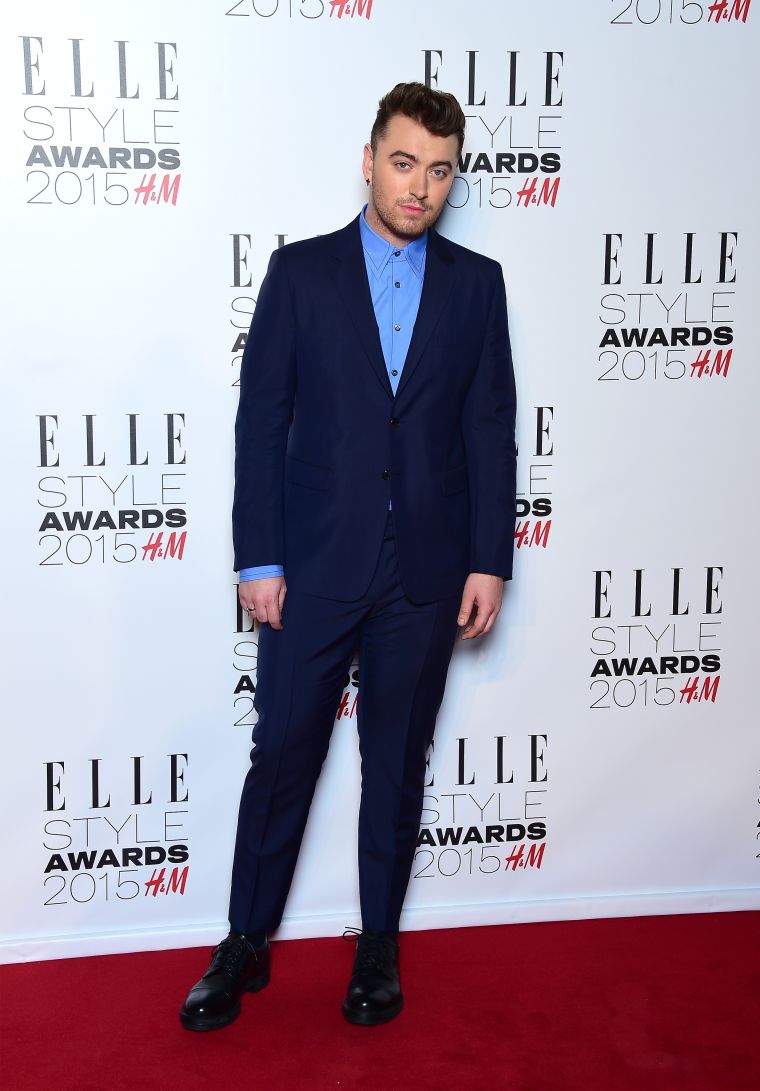 Sam Smith suited up in different hues of blue.