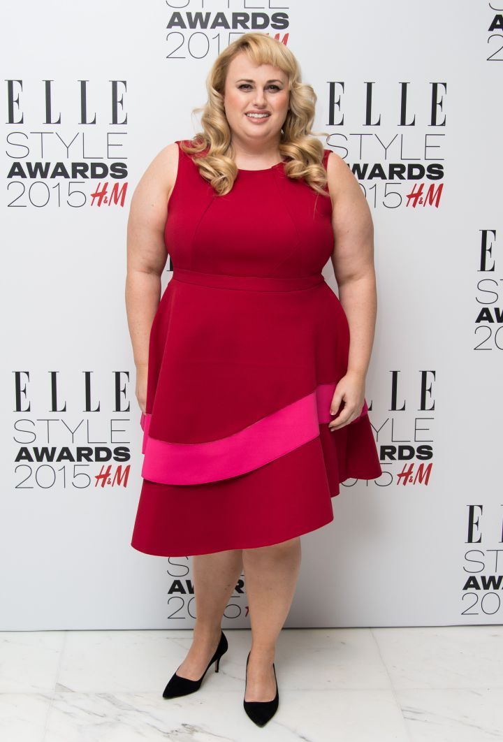 Rebel Wilson posed in a short, colorful frock.