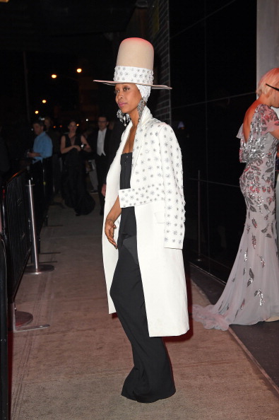 An extra-tall hat and a coat to match.