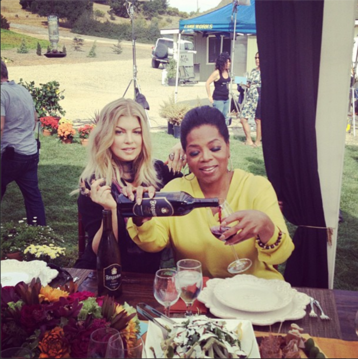 Oprah poured a glass as she interviewed Fergie at her home vineyard.