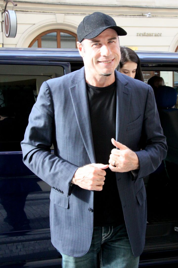 John Travolta was spotted visiting Prague for their film festival, and was all smiles.