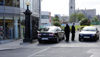 Security guards check cars at Annual General Meeting of the Irish