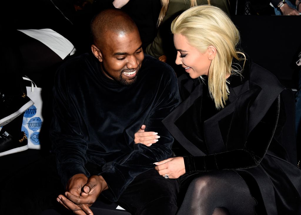 Kim Kardashian and Kanye West attend Balmain show during Paris Fashion Week