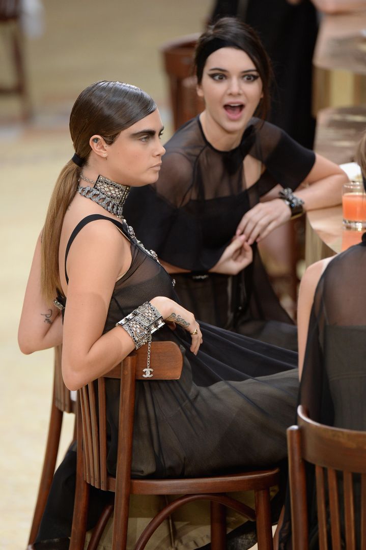 Cara Delevingne kept it chill as Kendall Jenner let it all out during the Chanel show as part of Paris Fashion Week.